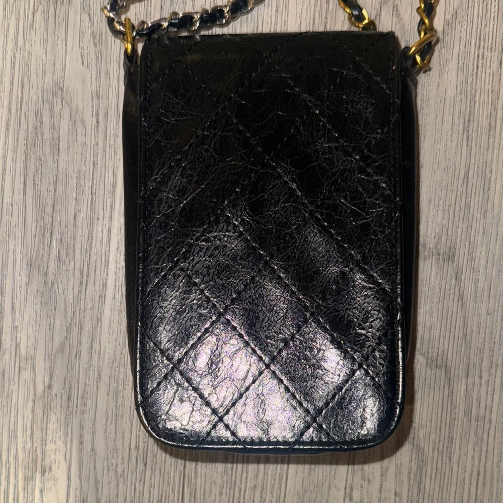 CHANEL Black Quilted Mini Bag with Gold Accents
